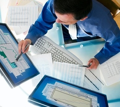 Image of a man working at a computer